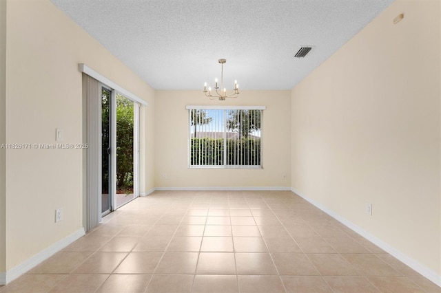1784 SW 110th Ter, Davie, FL 33324 - empty room with a chandelier, a textured ceiling, and light tile patterned flooring