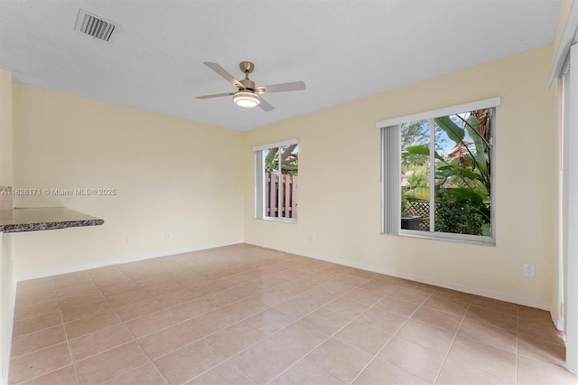 1784 SW 110th Ter, Davie, FL 33324 - empty room with a ceiling fan and light tile patterned floors