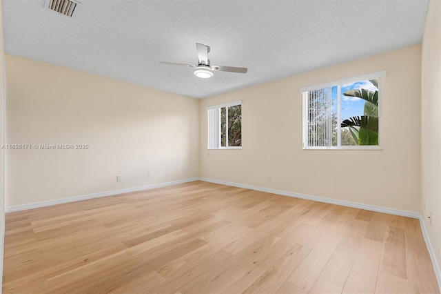1784 SW 110th Ter, Davie, FL 33324 - spare room with light wood-style flooring, ceiling fan, and a textured ceiling