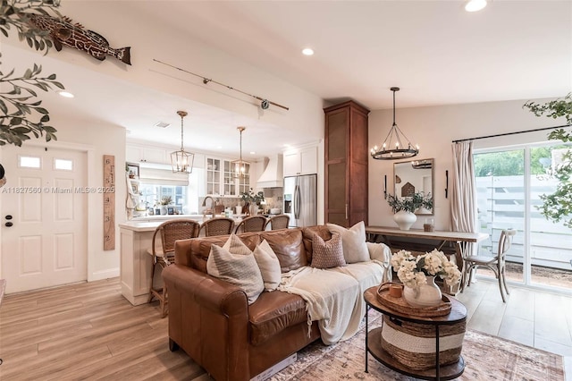 13765 SW 147th Cir Ln Unit 2-24, Miami, FL 33186 - living room with light wood-style floors, recessed lighting, and a chandelier