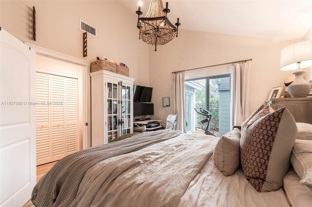 13765 SW 147th Cir Ln Unit 2-24, Miami, FL 33186 - bedroom with access to outside, high vaulted ceiling, a chandelier, french doors, and a closet