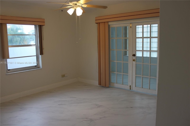 971 E 18th St, Hialeah, FL 33013 - unfurnished room with marble finish flooring, ceiling fan, and french doors