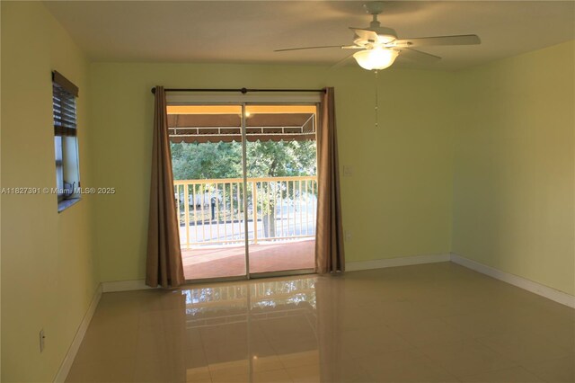 971 E 18th St, Hialeah, FL 33013 - tiled empty room with baseboards and a ceiling fan