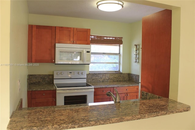 971 E 18th St, Hialeah, FL 33013 - kitchen with white appliances and brown cabinets