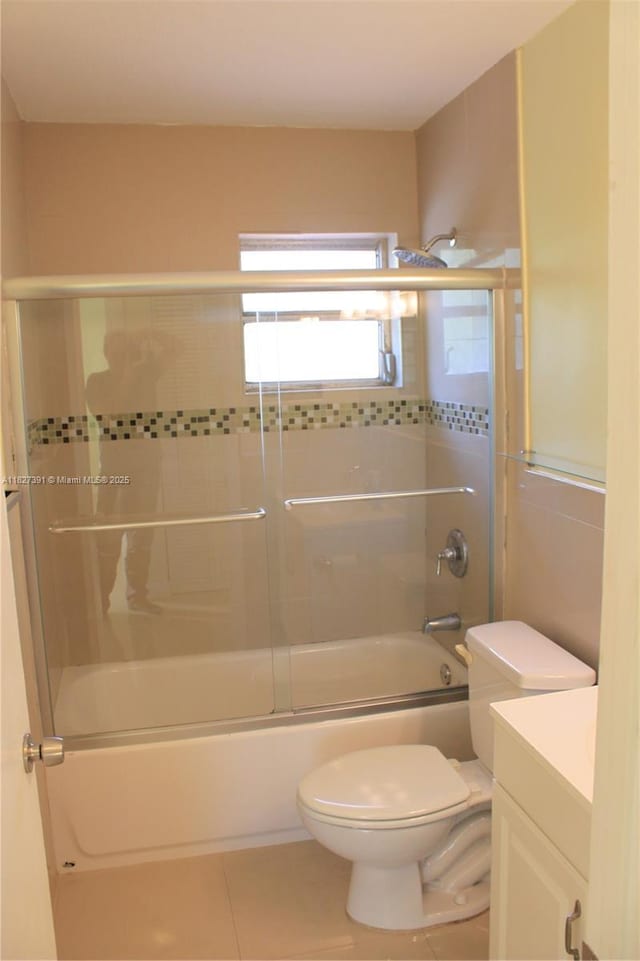 971 E 18th St, Hialeah, FL 33013 - full bath featuring vanity, combined bath / shower with glass door, and tile patterned floors