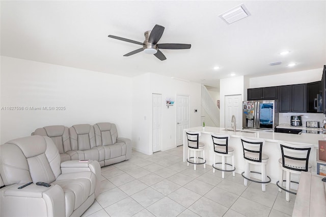 10628 W 33rd Way, Hialeah, FL 33018 - living area featuring ceiling fan, light tile patterned floors, recessed lighting, and stairway