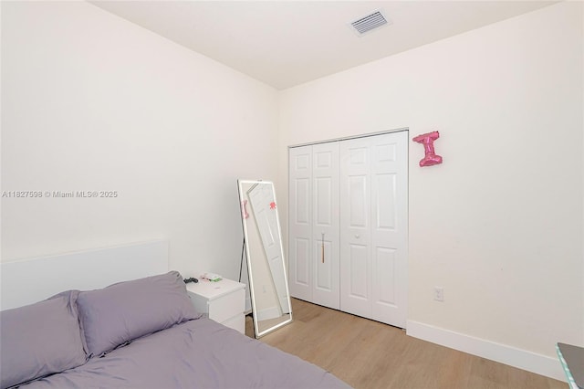 10628 W 33rd Way, Hialeah, FL 33018 - bedroom with light wood-style floors and a closet