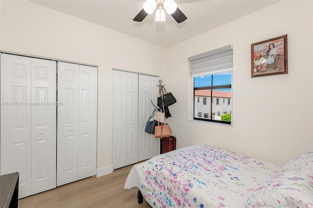 10628 W 33rd Way, Hialeah, FL 33018 - bedroom featuring multiple closets, light wood-type flooring, and a ceiling fan