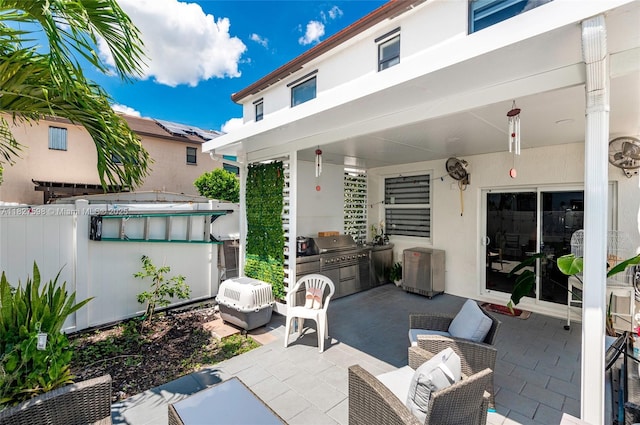 10628 W 33rd Way, Hialeah, FL 33018 - view of patio featuring an outdoor kitchen and an outdoor living space
