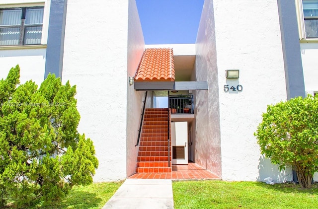 540 W Park Dr Unit 201, Miami, FL 33172 - view of exterior entry with stucco siding
