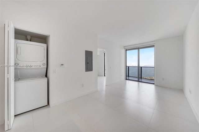 501 NE 31st St Unit 2005, Miami, FL 33137 - empty room featuring stacked washing machine and dryer and electric panel