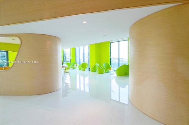 501 NE 31st St Unit 2005, Miami, FL 33137 - hallway with plenty of natural light, tile patterned flooring, and a wall of windows