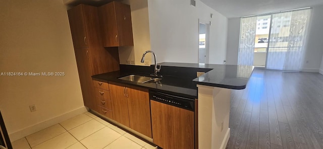 2775 NE 187th St Unit 424, Aventura, FL 33180 - kitchen with dishwashing machine, dark countertops, brown cabinets, and modern cabinets
