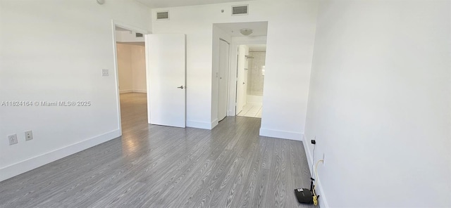 2775 NE 187th St Unit 424, Aventura, FL 33180 - spare room featuring wood finished floors and baseboards