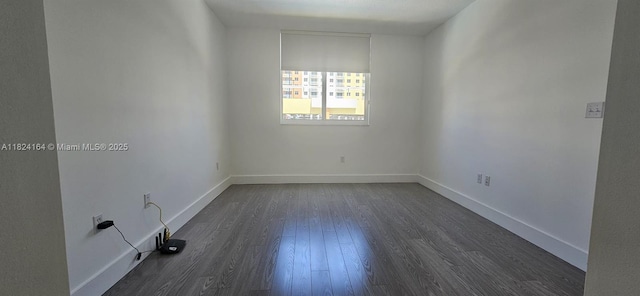 2775 NE 187th St Unit 424, Aventura, FL 33180 - unfurnished room with dark wood-style floors and baseboards