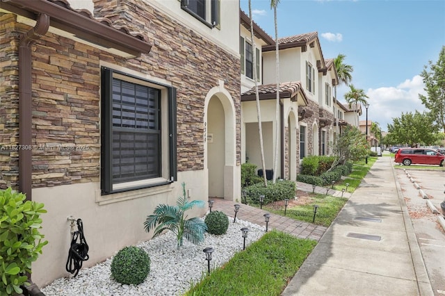 9349 W 33rd Way, Hialeah, FL 33018 - view of side of home with stucco siding and stone siding