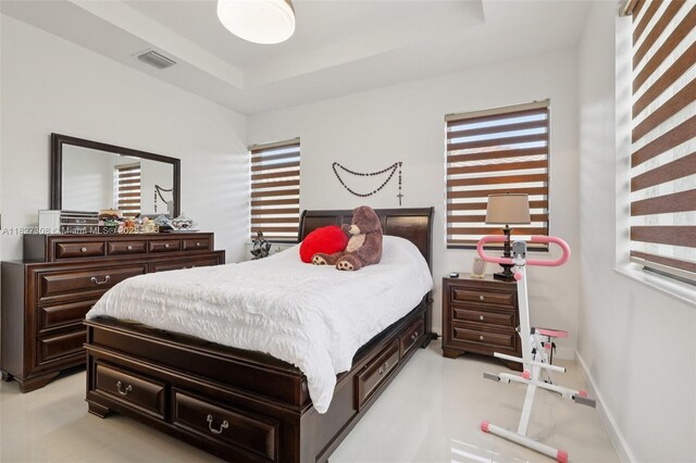 9349 W 33rd Way, Hialeah, FL 33018 - bedroom featuring multiple windows and a raised ceiling