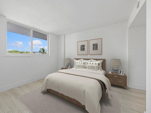 401 Ocean Dr Unit 403, Miami Beach, FL 33139 - bedroom featuring light wood-type flooring and baseboards