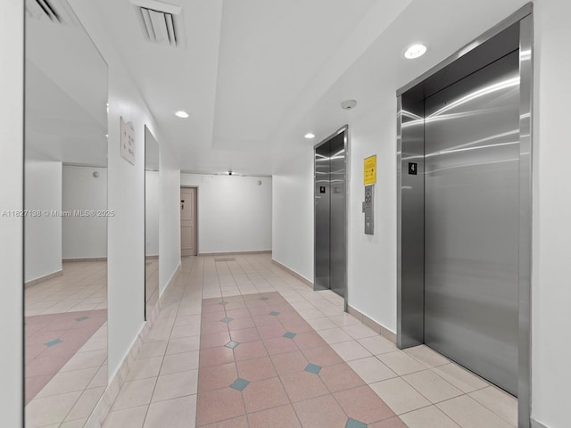 401 Ocean Dr Unit 403, Miami Beach, FL 33139 - corridor featuring elevator, light tile patterned flooring, and recessed lighting