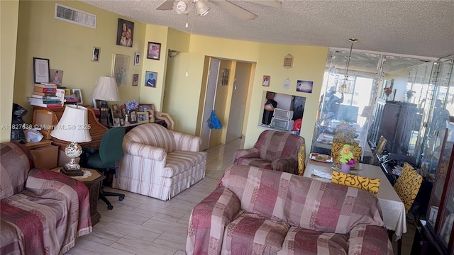 1750 NE 191st St Unit 804-1, Miami, FL 33179 - living room featuring ceiling fan, a textured ceiling, and expansive windows
