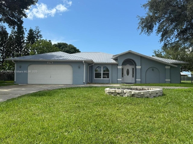 1046 Bayberry Loop, Clewiston, FL 33440 - ranch-style home featuring a metal roof, stucco siding, an attached garage, and a front yard