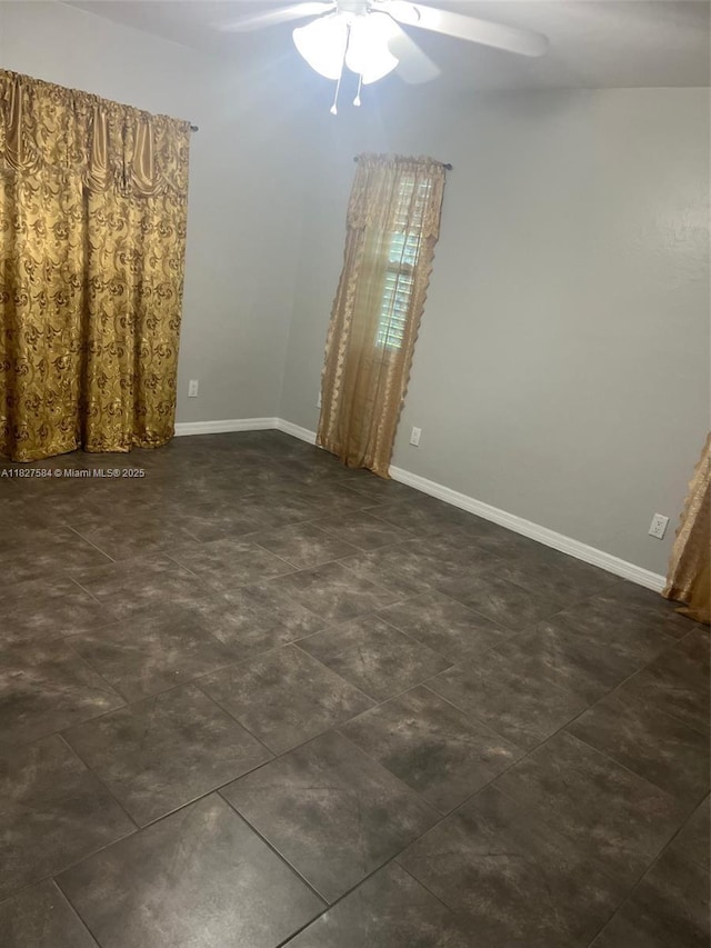 1046 Bayberry Loop, Clewiston, FL 33440 - spare room featuring ceiling fan and baseboards