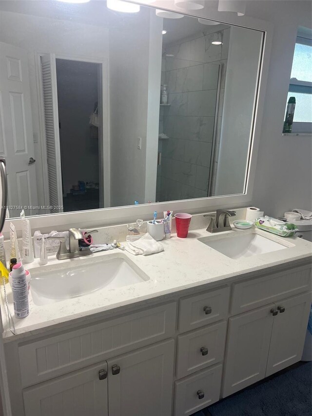 1046 Bayberry Loop, Clewiston, FL 33440 - full bathroom featuring double vanity, a closet, and a tile shower