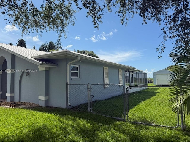 1046 Bayberry Loop, Clewiston, FL 33440 - view of side of property with stucco siding, a garage, and a sunroom