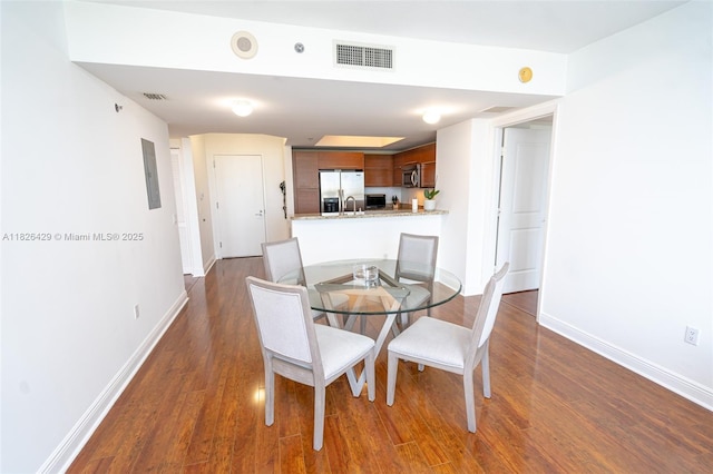 2641 N Flamingo Rd Unit 1603N, Sunrise, FL 33323 - dining space featuring dark wood-type flooring and baseboards