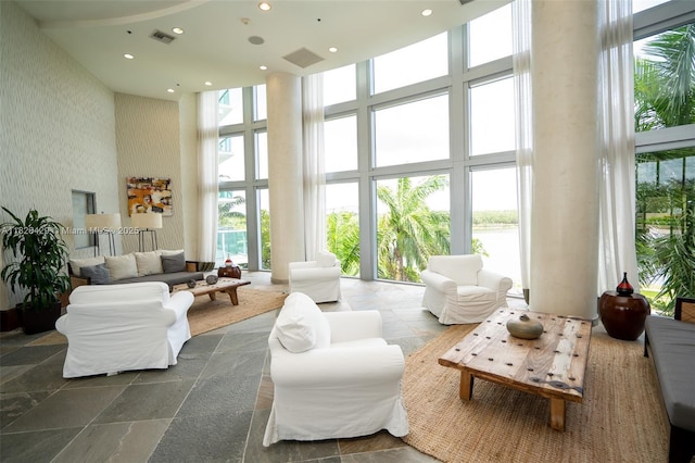 2641 N Flamingo Rd Unit 1603N, Sunrise, FL 33323 - living area featuring a high ceiling, recessed lighting, and a water view