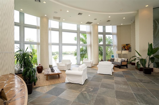 2641 N Flamingo Rd Unit 1603N, Sunrise, FL 33323 - community lobby featuring a towering ceiling, a water view, and recessed lighting