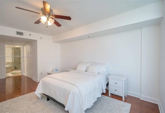 2641 N Flamingo Rd Unit 1603N, Sunrise, FL 33323 - bedroom featuring wood finished floors, ceiling fan, and connected bathroom