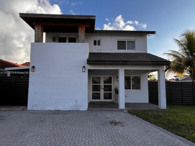 9023 NW 111th Ter, Hialeah Gardens, FL 33018 - rear view of house with french doors and stucco siding