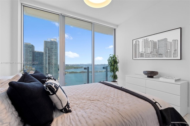 700 NE 26th Ter Unit 3101, Miami, FL 33137 - bedroom with a water view and expansive windows