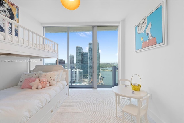 700 NE 26th Ter Unit 3101, Miami, FL 33137 - bedroom featuring floor to ceiling windows, access to exterior, carpet floors, and a skyline view