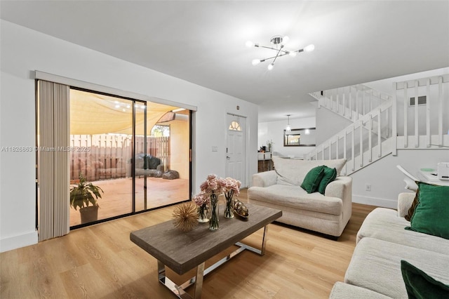 806 SW 119th Way, Davie, FL 33325 - living area featuring a chandelier, stairway, and light wood finished floors