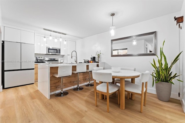 806 SW 119th Way, Davie, FL 33325 - dining space featuring light wood finished floors