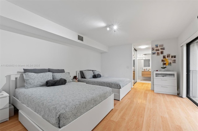 806 SW 119th Way, Davie, FL 33325 - bedroom with light wood finished floors and connected bathroom