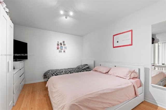 806 SW 119th Way, Davie, FL 33325 - bedroom with light wood-style floors and baseboards