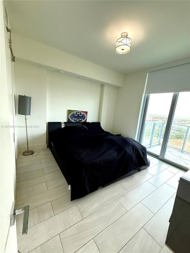 2000 Metropica Way Unit 1605, Sunrise, FL 33323 - bedroom featuring access to exterior and light tile patterned floors