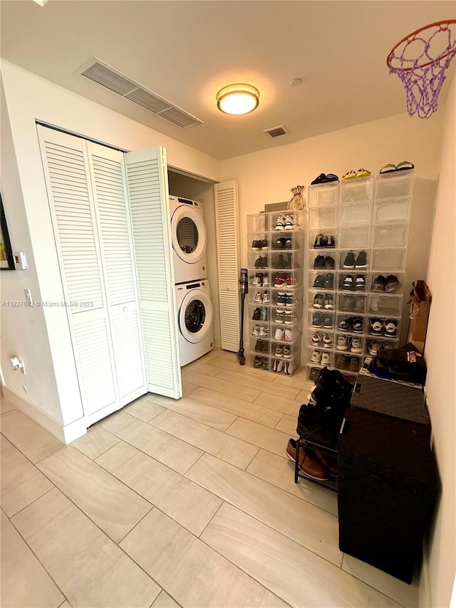 2000 Metropica Way Unit 1605, Sunrise, FL 33323 - washroom featuring estacked washer and dryer and tile patterned floors