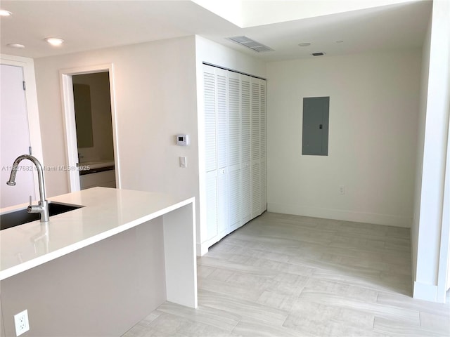 2000 Metropica Way Unit 1605, Sunrise, FL 33323 - kitchen featuring electric panel, light countertops, and recessed lighting