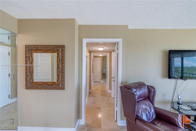 2000 Towerside Ter Unit 1112, Miami, FL 33138 - hallway featuring a textured ceiling