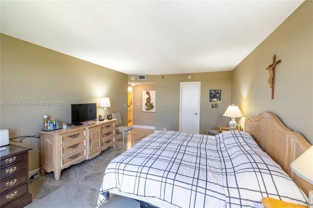 2000 Towerside Ter Unit 1112, Miami, FL 33138 - bedroom featuring baseboards and a textured ceiling