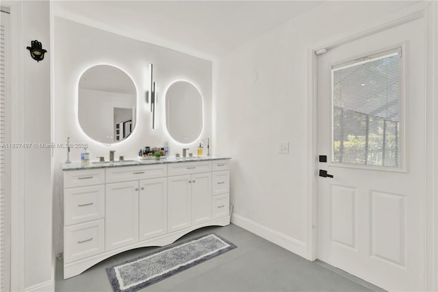 8525 NW 49th Dr, Coral Springs, FL 33067 - bathroom with double vanity and concrete floors