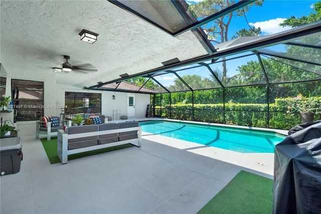 8525 NW 49th Dr, Coral Springs, FL 33067 - outdoor pool featuring a patio area, an outdoor living space, glass enclosure, and ceiling fan