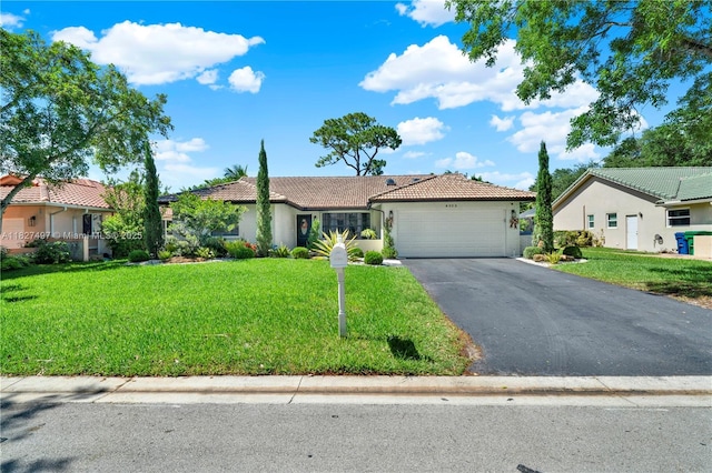 8525 NW 49th Dr, Coral Springs, FL 33067 - single story home with driveway, an attached garage, a tile roof, and a front lawn
