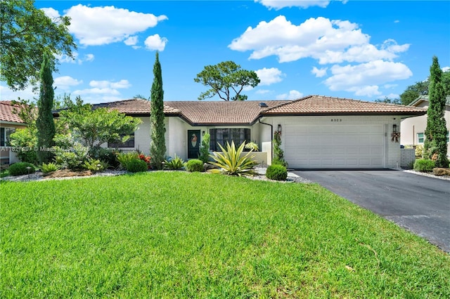 8525 NW 49th Dr, Coral Springs, FL 33067 - ranch-style home with a tiled roof, asphalt driveway, a garage, and brick siding
