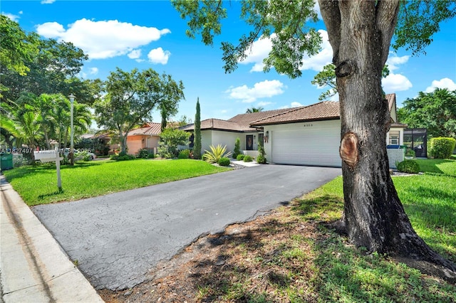 8525 NW 49th Dr, Coral Springs, FL 33067 - ranch-style house featuring driveway, an attached garage, stucco siding, a front lawn, and a tile roof