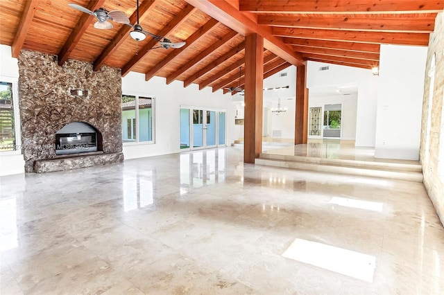 5881 SW 160th Ave, Southwest Ranches, FL 33331 - unfurnished living room with a wooden ceiling with exposed beams, a stone fireplace, plenty of natural light, ceiling fan, and high vaulted ceiling